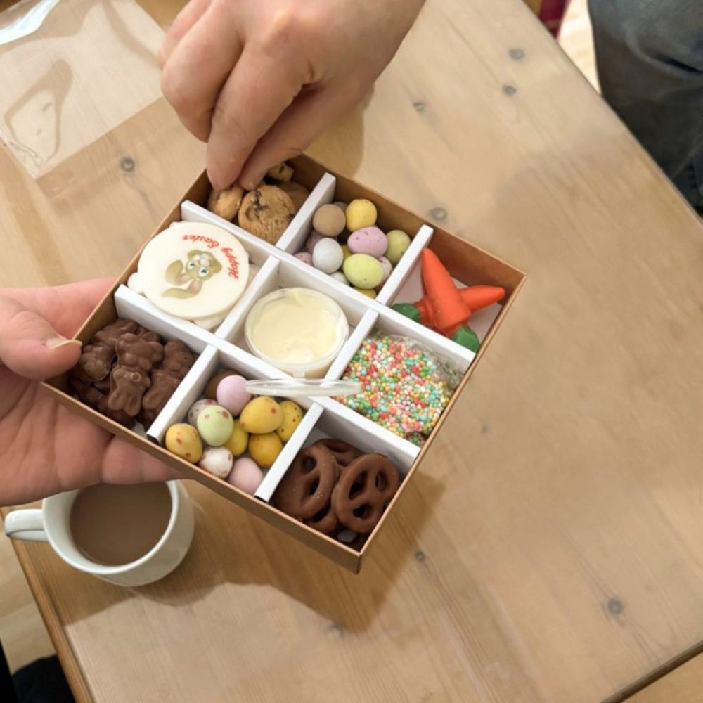 Easter Grazing Box, Hand Dipping into Cookies